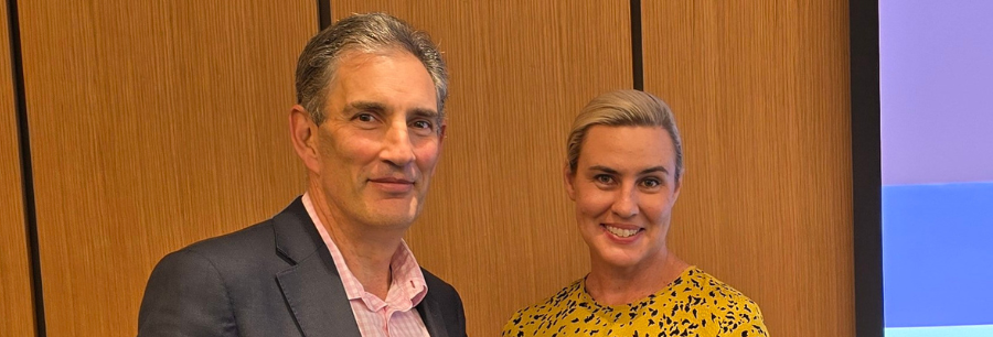 Richard with NSW Fair Trading Commissioner banner